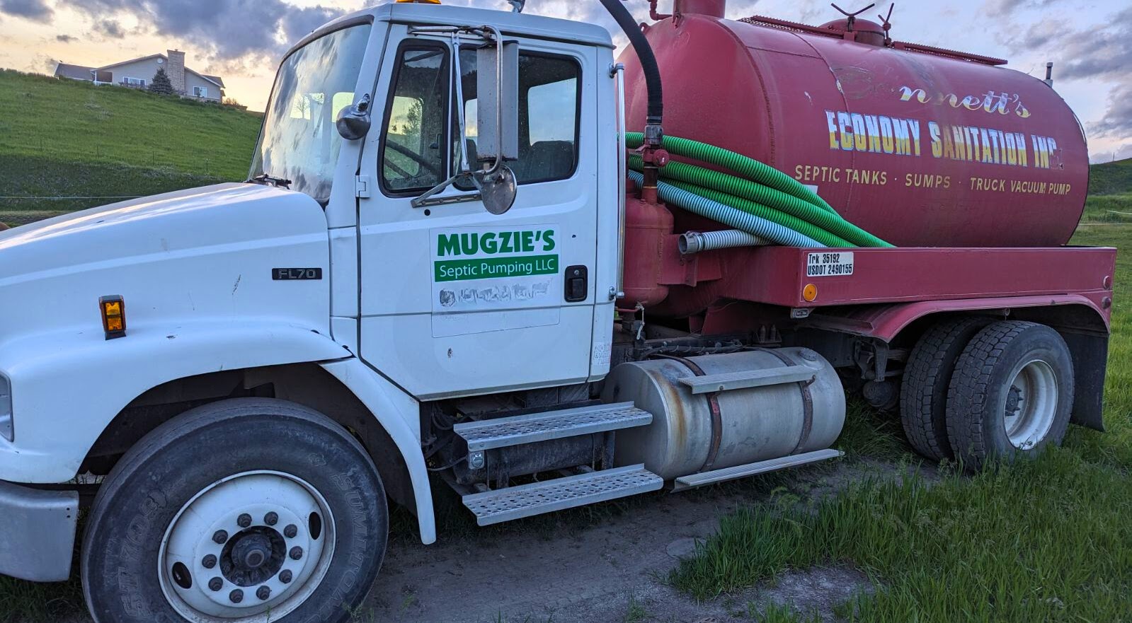 Mugzie’s pumping truck parked on grass
